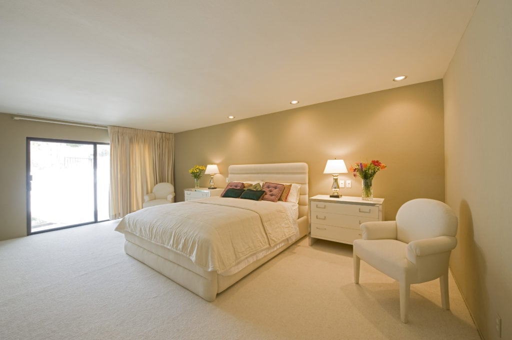 From simple bedrooms to inspirational living rooms, we're sharing 20 tips that will help you design a minimalist space you will love. Learn the tricks to developing pleasing aesthetics in any room and get tips for minimalist decor & color ideas. See how incorporating simple furniture, natural wood elements, and smart organization can help you create the minimized space of your dreams. #minimalism #minimalistdecor #simplify